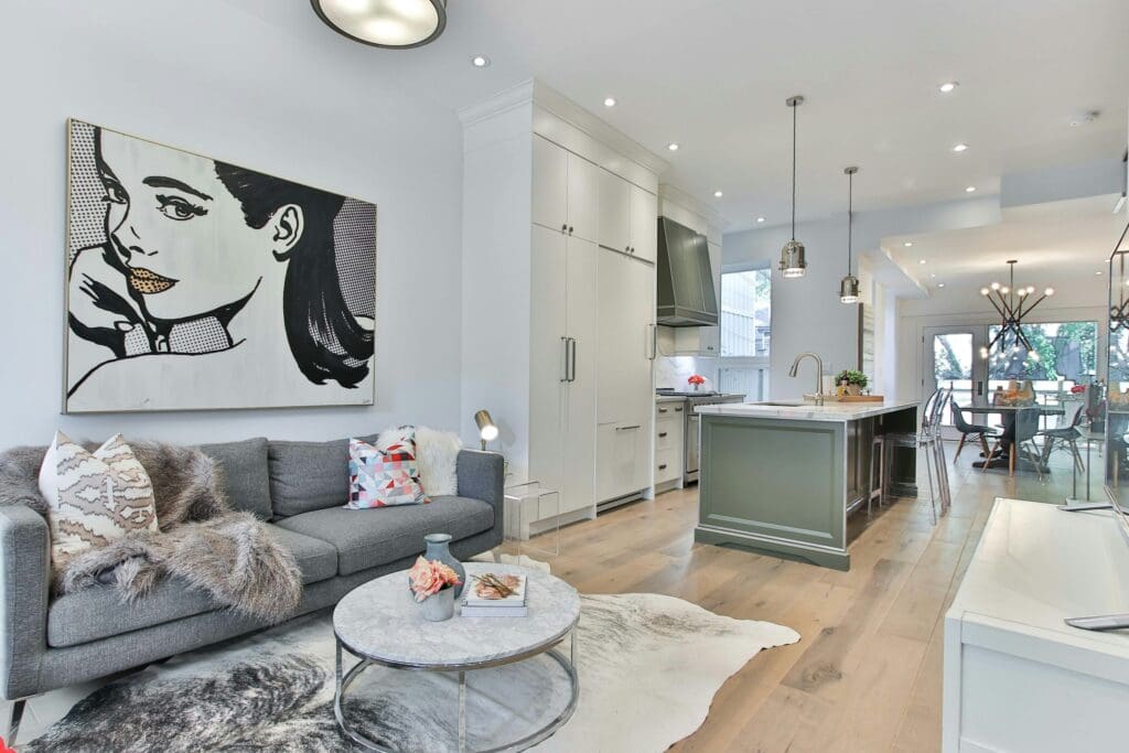 A beautiful living room with a nice ambiance, seamlessly connecting to the kitchen and dining area for an open and inviting feel. A lease to own home that provides a stylish and functional space for comfortable everyday living.