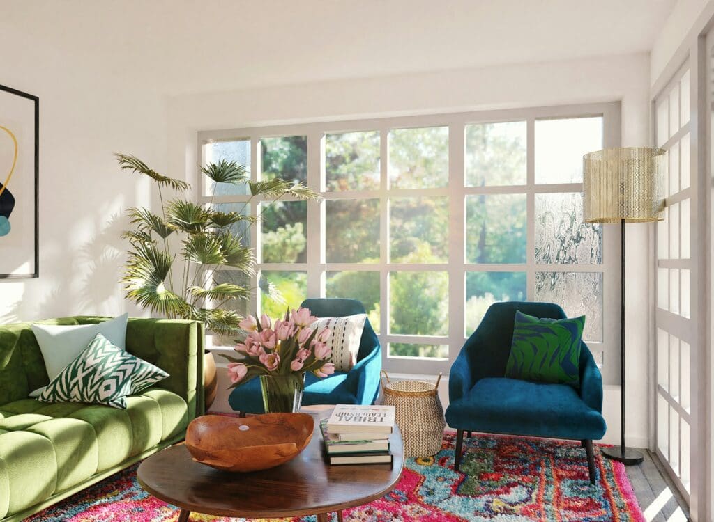 A stylish and inviting living room, featuring a blue and green sofa, elegant decor, and soft lighting. The sun on the window panes shines just right, creating a cozy and welcoming atmosphere in a lease to own home in Raleigh.