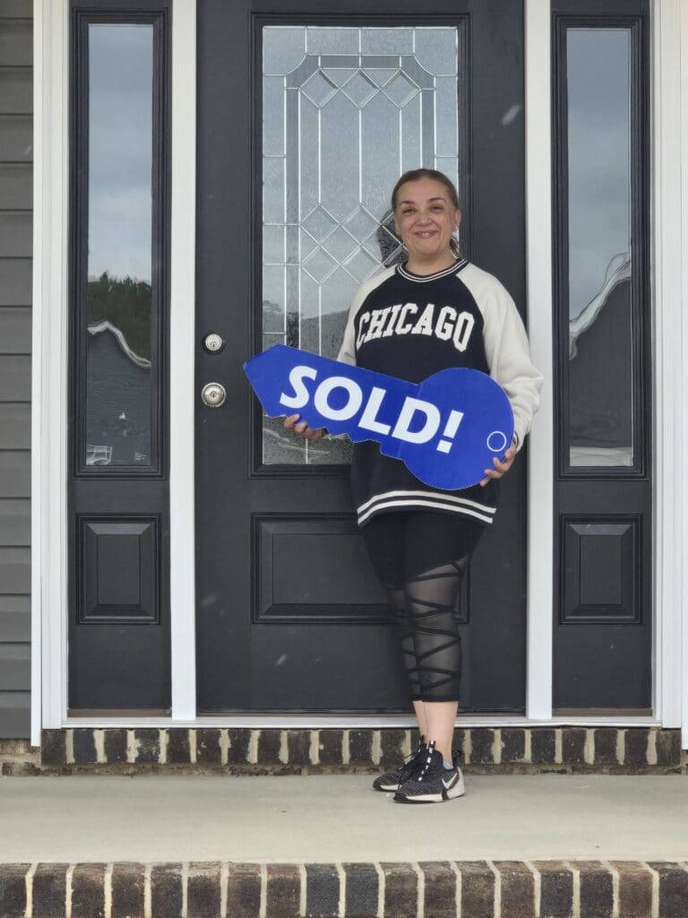 Paula is happily standing in front of her new home, reflecting on her positive experience with lease-to-own. She and her husband found the process smooth and rewarding, allowing them to secure a brand-new home.