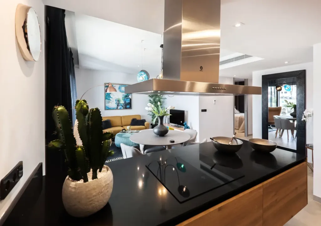 Modern kitchen and living room with warm lightning.