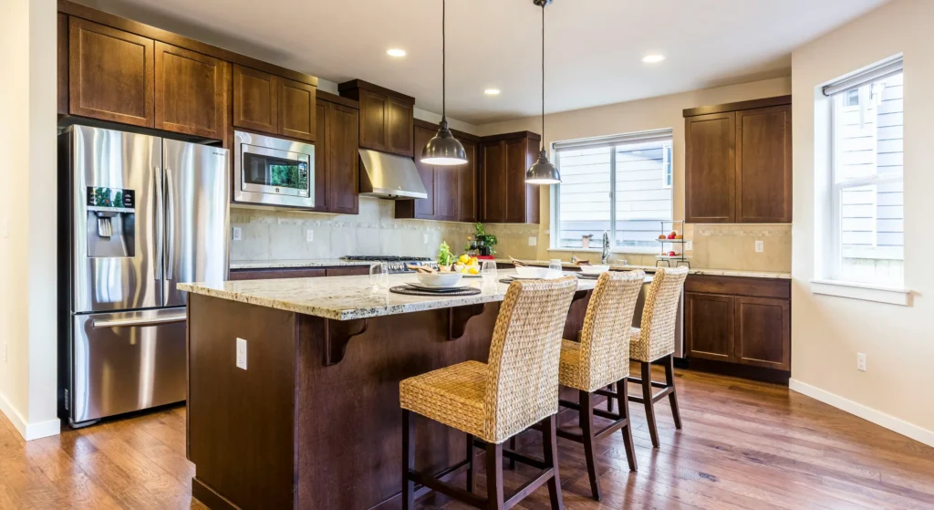 bright kitchen with island and stainless steel appliances in a home for sale Greensboro NC with lease to own option